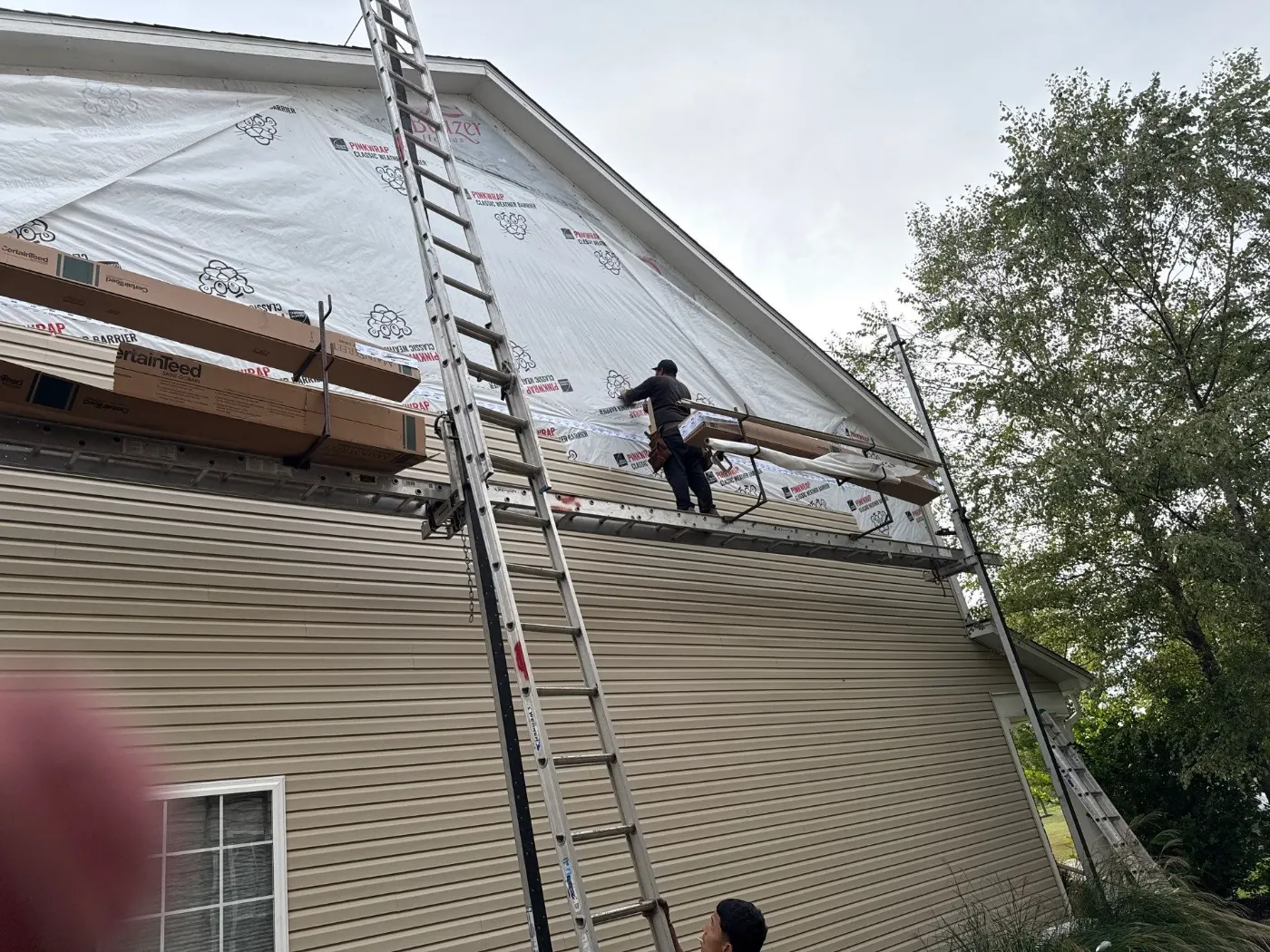 Siding installation documented in Spring Orchard